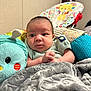 Emory is registered to the contest to win money with this photo: applique, architecture, baby, bed, bedroom, blanket, bodypart, building, clothing, couch, crib, cushion, face, finger, furniture, hand, happy, hat, head, homedecor