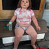 Leila joined the competition — help win amazing prizes! bench, bottle, casual, child, door, expression, face, feet, hair, outdoor, person, porch, shirt, shorts, sitting, skin, summer, toddler, toy, wood