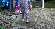 Leila joined the competition — help win amazing prizes! toddler, child, pajamas, running, toy, slide, outdoor, backyard, smiling, happy, recycling_bin, car, fence, grass, concrete, trees, play, person, daylight, footwear