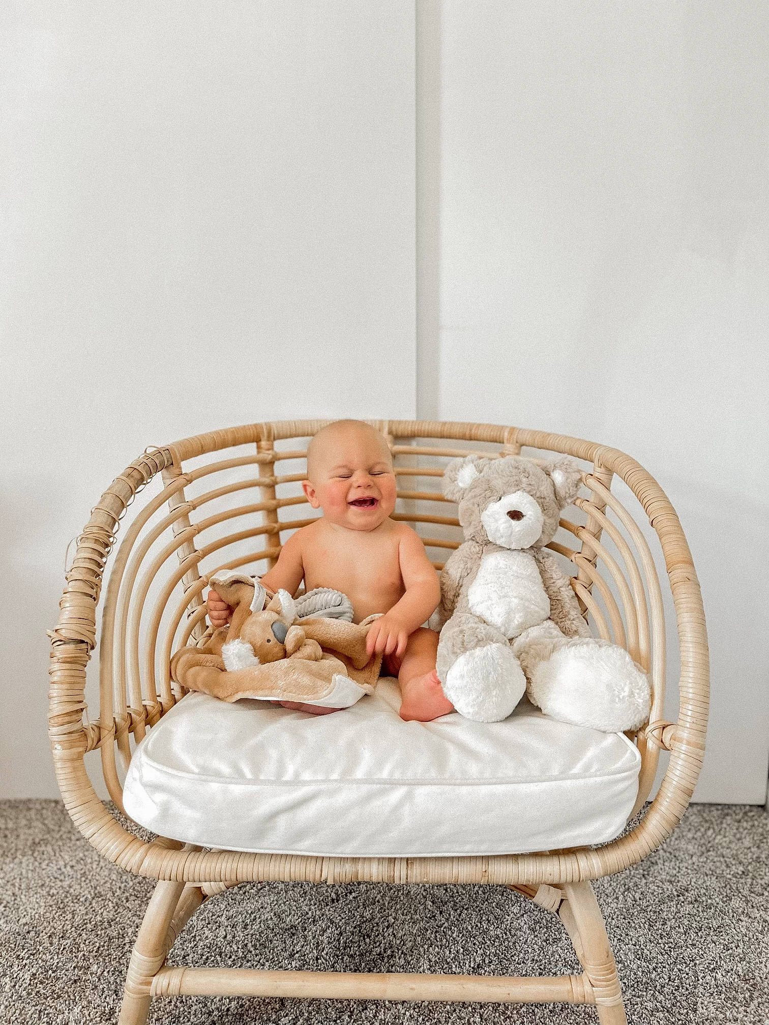 Zeke is registered to the contest to win money with this photo: baby, baby_products, baby_toddler_clothing, chair, child, comfort, couch, event, fur, furniture, grass, hardwood, leisure, outdoor_furniture, person, room, sitting, throw_pillow, toddler, wicker