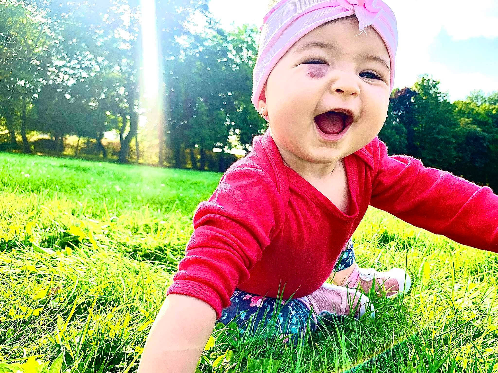 Marcelina joined the competition — help win amazing prizes! baby, baby_laughing, baby_toddler_clothing, cool, facial_expression, finger, flash_photography, fun, grass, green, happy, headwear, leisure, people_in_nature, person, plant, sky, smile, sunlight, toddler