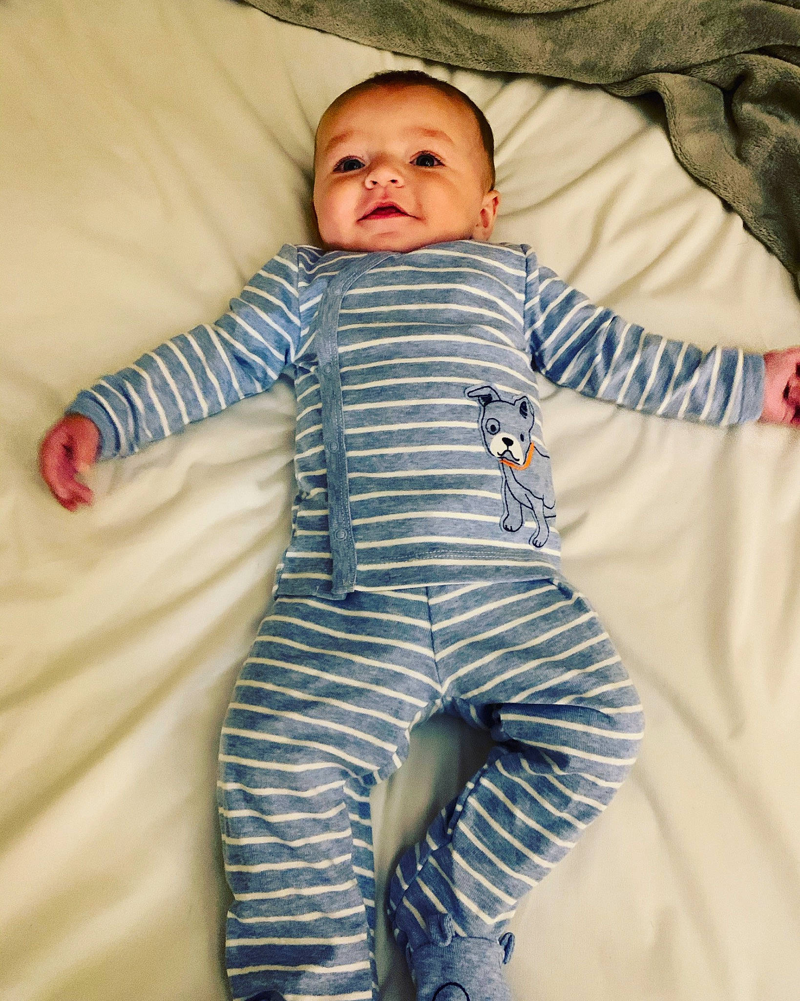 Wesley is registered to the contest to win money with this photo: active_pants, baby, baby_products, baby_toddler_clothing, blanket, comfort, linens, nightwear, nose, pajamas, person, sleeve