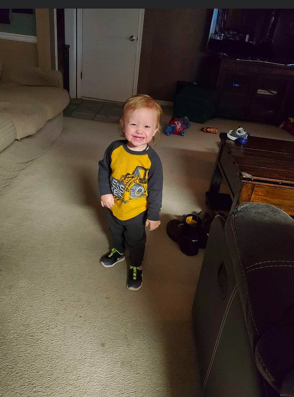 William joined the competition — help win amazing prizes! automotive_design, chair, child, comfort, floor, flooring, fun, hardwood, home_appliance, human_leg, joy, knee, person, room, shorts, sitting, smile, t_shirt, television, toddler