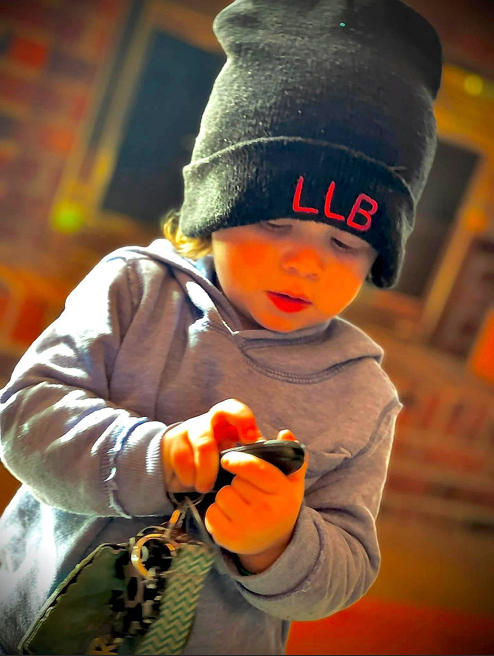 William is registered to the contest to win money with this photo: baby, beanie, cap, child, cool, costume_hat, fashion_accessory, flash_photography, fun, glove, happy, hat, headwear, jacket, orange, outerwear, person, personal_protective_equipment, sleeve, toddler