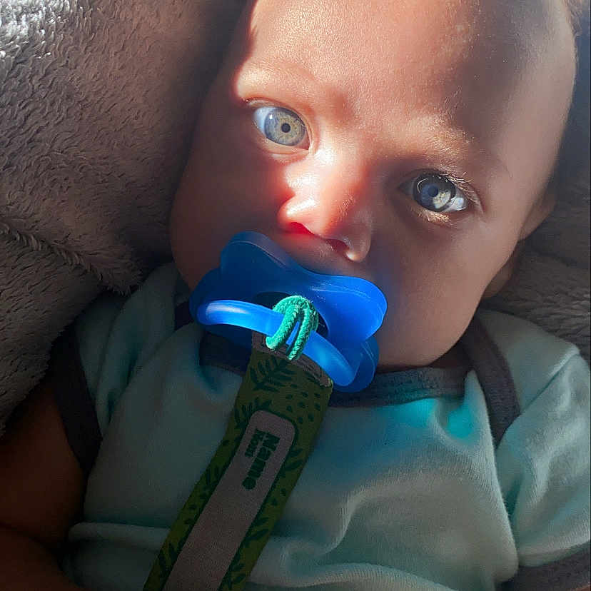 Cj is registered to the contest to win money with this photo: azure, baby, cheek, chin, dress, ear, electric_blue, eye, eyebrow, eyelash, finger, hand, human_body, iris, lip, mouth, nose, skin, thumb, toddler