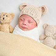 Lennox Maximus joined the competition — help win amazing prizes! baby, sleeping, blanket, knitted_hat, teddy_bear, soft_toy, cozy, cute, infant, wrapped, headwear, child, bedtime, rest, adorable, warm, comfort, portrait, indoor, peaceful