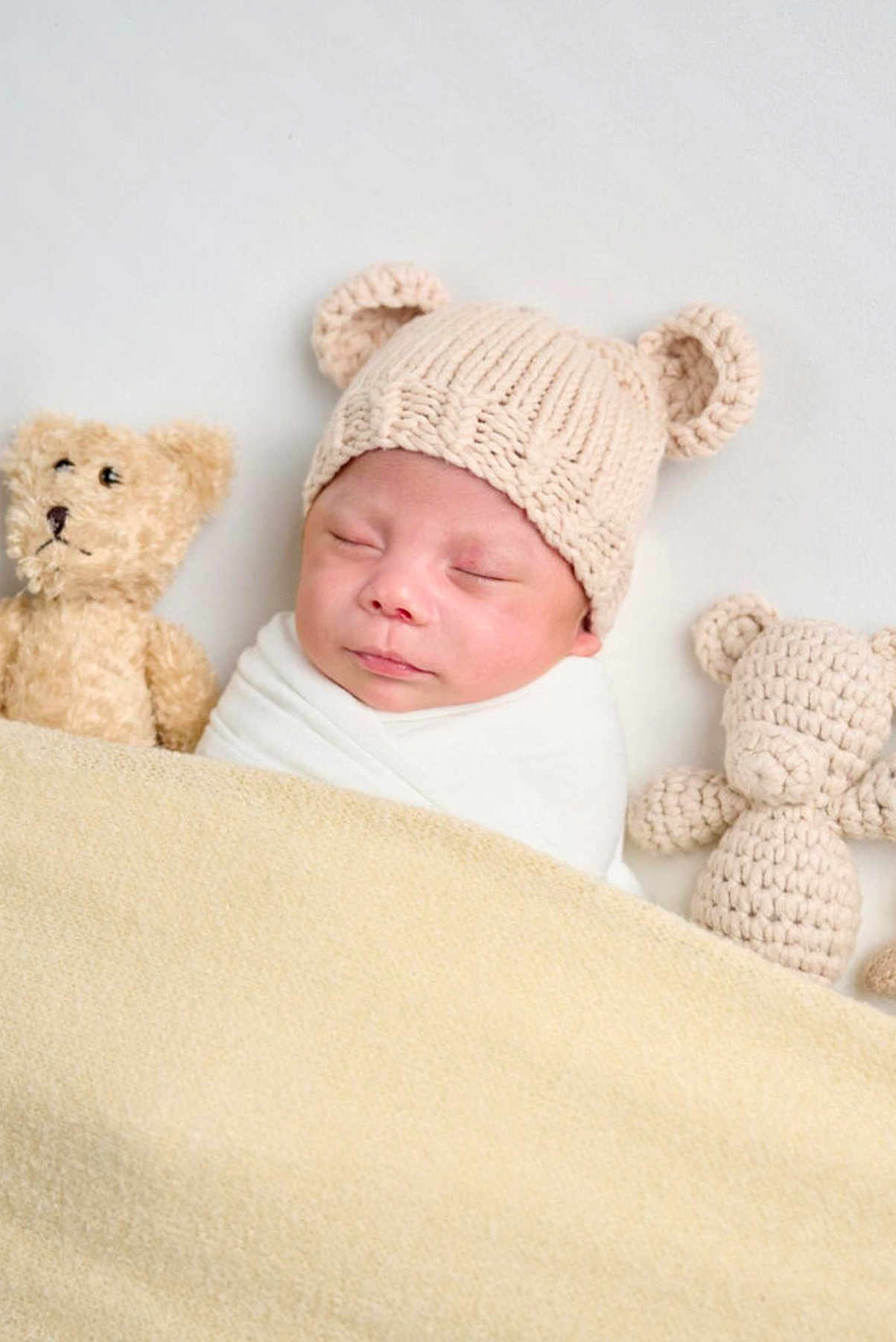Lennox Maximus joined the competition — help win amazing prizes! baby, sleeping, blanket, knitted_hat, teddy_bear, soft_toy, cozy, cute, infant, wrapped, headwear, child, bedtime, rest, adorable, warm, comfort, portrait, indoor, peaceful