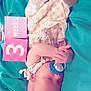 Navie is registered to the contest to win money with this photo: animal, architecture, baby, bed, bird, blanket, bodypart, building, diaper, face, finger, furniture, hand, head, hospital, newborn, penguin, person, photography, portrait