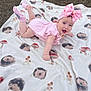 baby, child, pink_dress, headband, bow, blanket, hedgehog_pattern, mushroom_pattern, outdoor, grass, tummy_pose, smiling, cute, infant, happy, clothing, sock, portrait, playtime, soft_texture