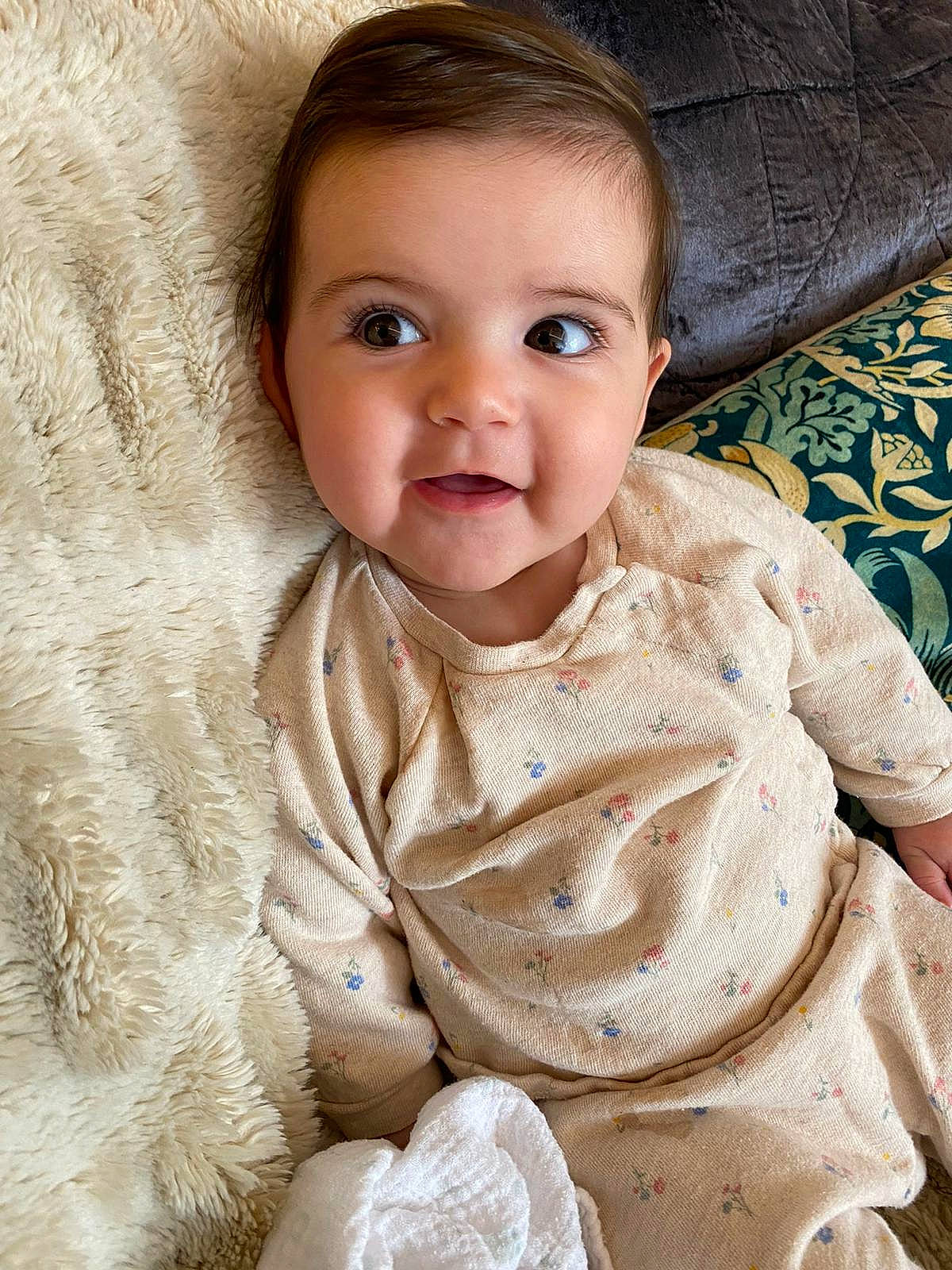 Anya is registered to the contest to win money with this photo: baby, baby_toddler_clothing, cheek, collar, comfort, eye, eyebrow, face, head, iris, linens, lip, nose, outerwear, person, skin, sleeve, smile, textile, toddler