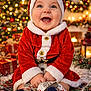 Lyloo participe au concours pour gagner de l'argent avec cette photo : baby, blanket, celebration, child, christmas, cozy, cute, decorations, festive, fireplace, gifts, happy, holiday, indoors, lights, red_clothing, santa_outfit, smiling, winter, wreath