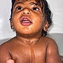 baby, child, wet_skin, water_droplets, curly_hair, close_up, face, expression, bath_time, skin, mouth_open, eyes, portrait, indoors, head, shoulders, cute, adorable, young, person