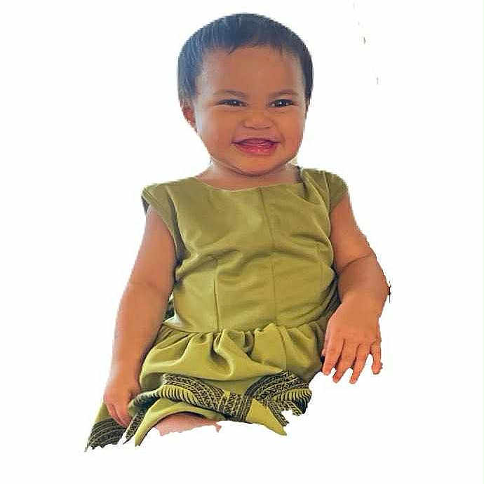 Joisa joined the competition — help win amazing prizes! baby, bright_background, cheerful, child, clothing, cute, fashion, green_dress, happy, indoor, isolated, joyful, person, playful, portrait, short_hair, sitting, smiling, toddler, young_child