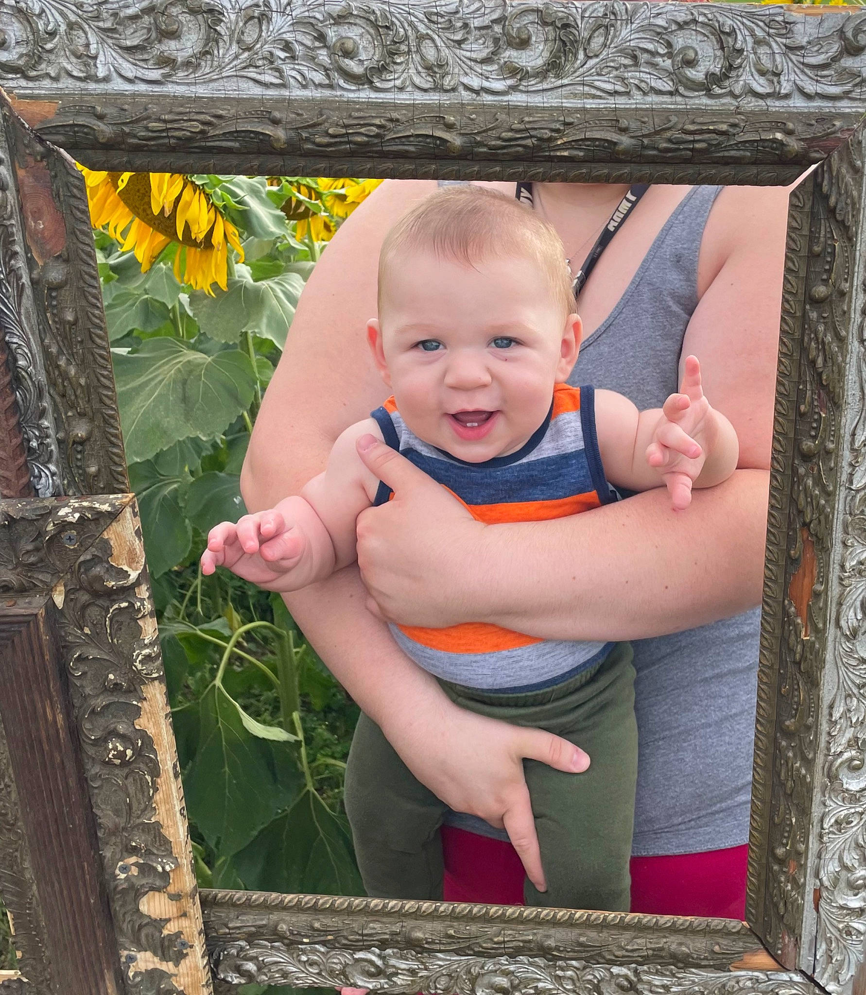 Keagan is registered to the contest to win money with this photo: baby, baby_toddler_clothing, cheek, chin, eye, flower, fun, grass, happy, leaf, leisure, pattern, people_in_nature, person, product, rectangle, sitting, smile, textile, toddler