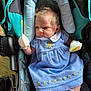 Gabriella joined the competition — help win amazing prizes! baby, infant, car_seat, blue_dress, mittens, socks, face, person, child, cute, newborn, clothing, pattern, fabric, seat, indoor, portrait, expression, hair, footwear