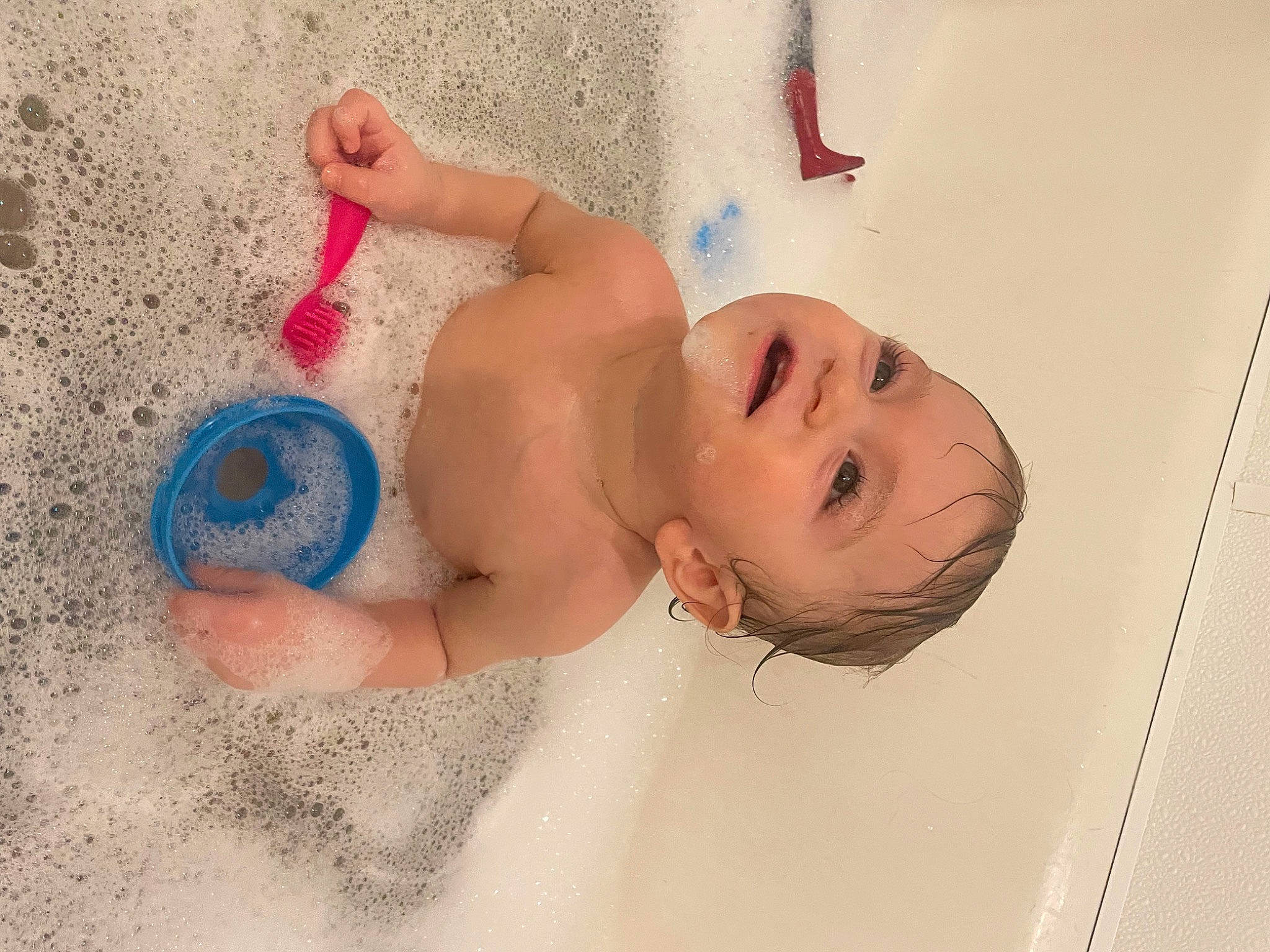 Nico is registered to the contest to win money with this photo: abdomen, arm, baby, bathing, beach, chest, child, facial_expression, finger, foot, fun, happy, headgear, person, sand, skin, smile, stomach, textile, toddler