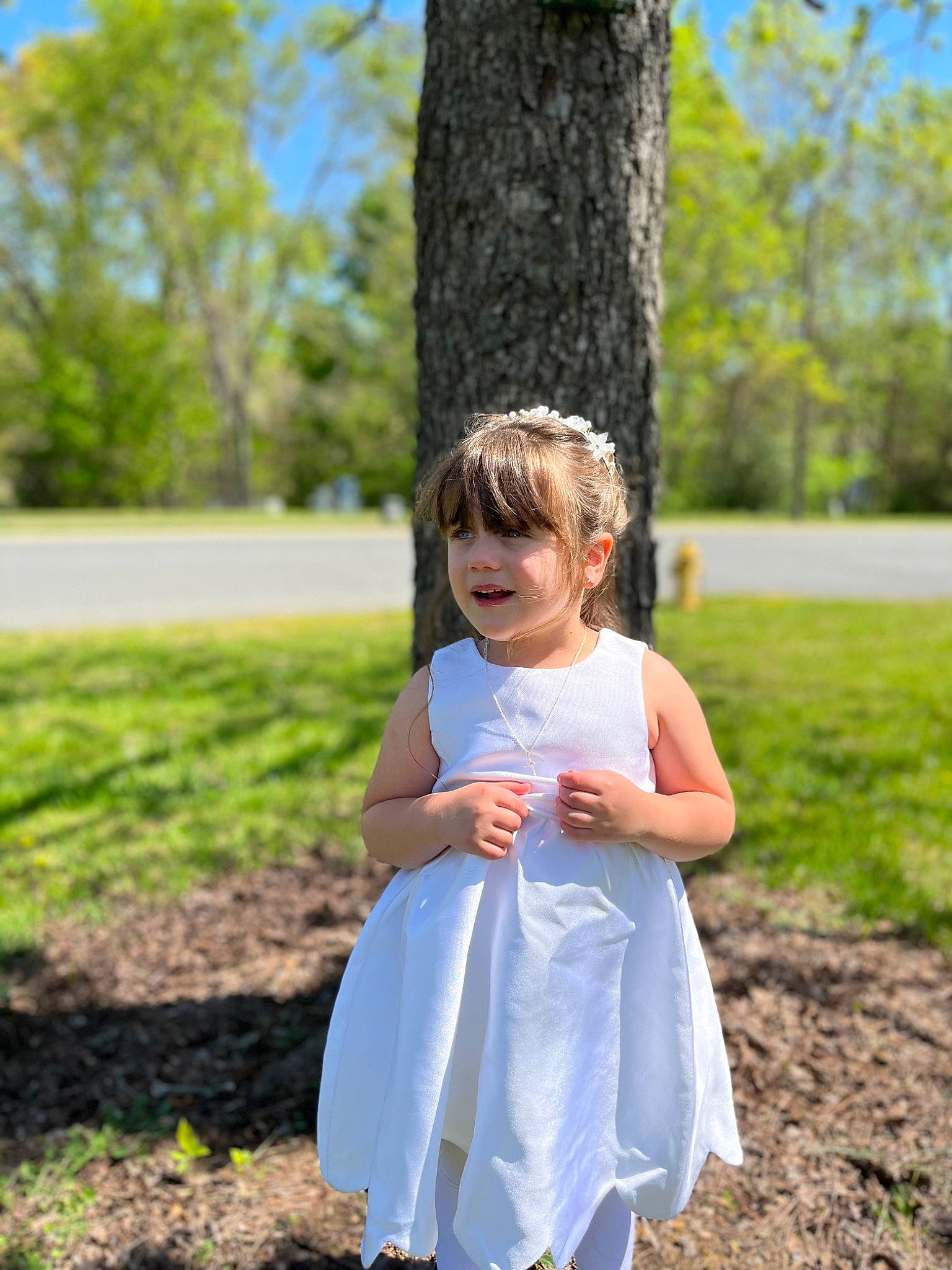 Gabriella is registered to the contest to win money with this photo: baby_toddler_clothing, blond, day_dress, dress, electric_blue, fun, grass, green, happy, leaf, leisure, one_piece_garment, people_in_nature, person, plant, recreation, shoulder, sleeve, summer, toddler