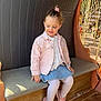 Kessy a rejoint le concours — aidez-le/la à gagner de superbes lots ! child, girl, pink_jacket, denim_skirt, pink_sneakers, carousel, amusement_park, bench, seat, rope, wooden_floor, smiling, outdoor, sunlight, playful, casual_clothing, toddler, cute, happy, portrait