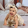 Sofia is registered to the contest to win money with this photo: baby, child, crawling, headband, dress, smiling, teddy_bear, balloon, picture_frame, floor, wooden_floor, indoors, cute, happy, infant, playful, smile, person, portrait, background