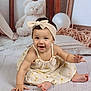 Sofia joined the competition — help win amazing prizes! baby, child, smiling, headband, dress, floor, teddy_bear, balloon, picture_frame, wooden_floor, indoor, cute, portrait, happy, infant, sitting, toy, decor, light_skin, young_child