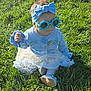 baby, toddler, child, grass, sunglasses, blue_headband, bow, dress, cardigan, shoe, sitting, outdoor, park, bench, sunlight, shadow, cute, portrait, green_grass, playful