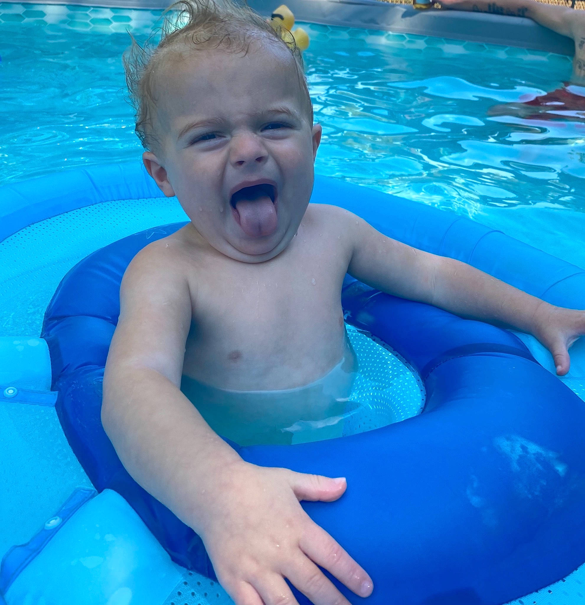 Jenson joined the competition — help win amazing prizes! aqua, azure, baby, bathing, blue, chest, child, fluid, fun, happy, leisure, muscle, outdoor_recreation, person, photograph, recreation, red, summer, swimming_pool, toddler