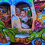 amusement_ride, carnival, chain, child, clothing, colorful, curious, decorations, entertainment, face, festival, indoor, lights, person, playful, ride, seatbelt, smile, toddler, toy_car