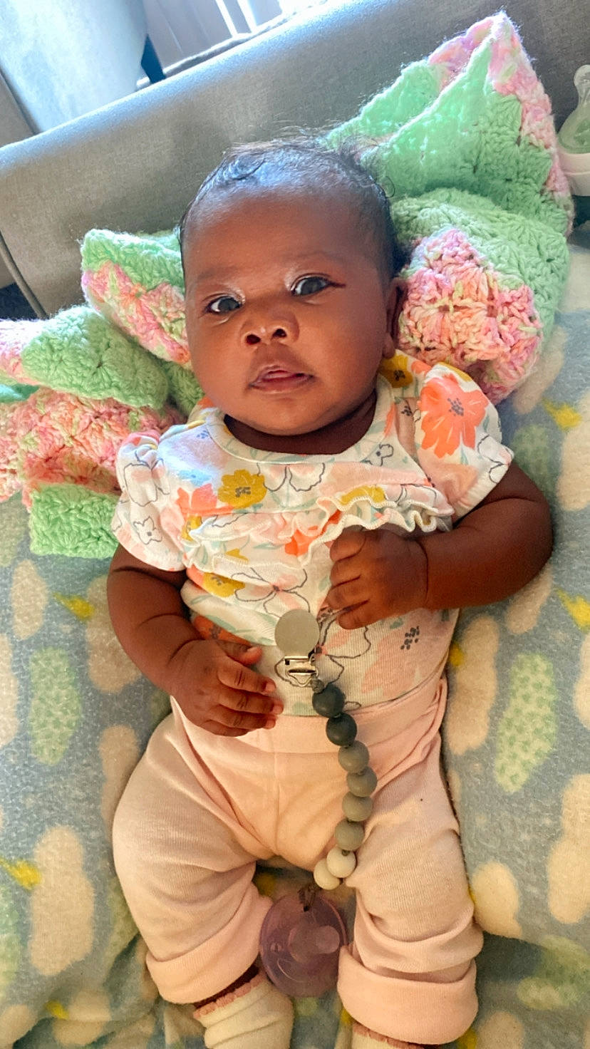 Noelle joined the competition — help win amazing prizes! baby, baby_toddler_clothing, cheek, child, comfort, eye, fun, happy, linens, lip, peach, person, pink, room, sitting, skin, sleeve, t_shirt, textile, toddler