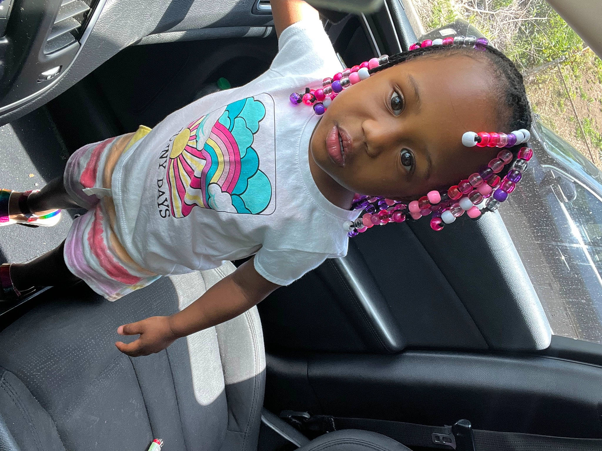 Legacy is registered to the contest to win money with this photo: auto_part, automotive_design, automotive_exterior, automotive_lighting, automotive_window_part, bumper, car, car_seat, car_seat_cover, child, family_car, motor_vehicle, person, personal_luxury_car, pink, steering_wheel, toddler, vehicle, vehicle_door, window