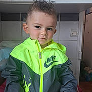 Gabriel a rejoint le concours — aidez-le/la à gagner de superbes lots ! boy, cabinet, casual, child, clothing, curious, face, hair, hand, home, indoor, jacket, light_switch, neon, nike, portrait, sitting, smile, spiked_hair, toddler