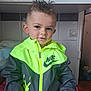boy, cabinet, casual, child, clothing, curious, face, hair, hand, home, indoor, jacket, light_switch, neon, nike, portrait, sitting, smile, spiked_hair, toddler