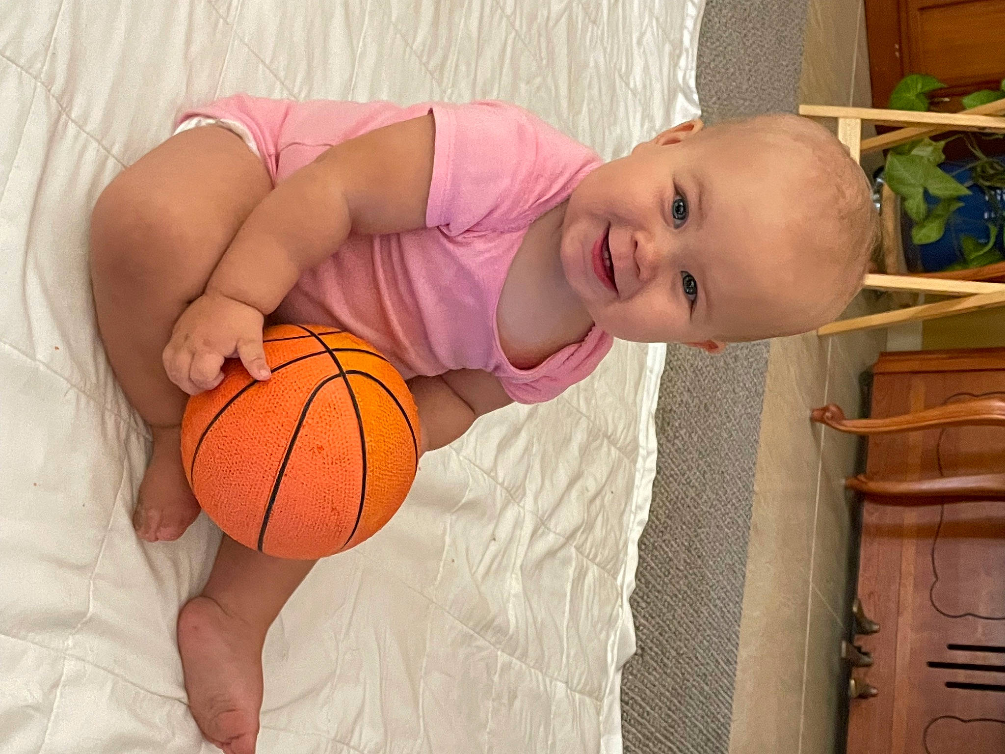 Jordyn is registered to the contest to win money with this photo: abdomen, baby, baby_toddler_clothing, ball, basketball, basketball_player, chest, elbow, finger, fun, human_body, joy, knee, muscle, person, player, sports, sports_equipment, sportswear, toddler