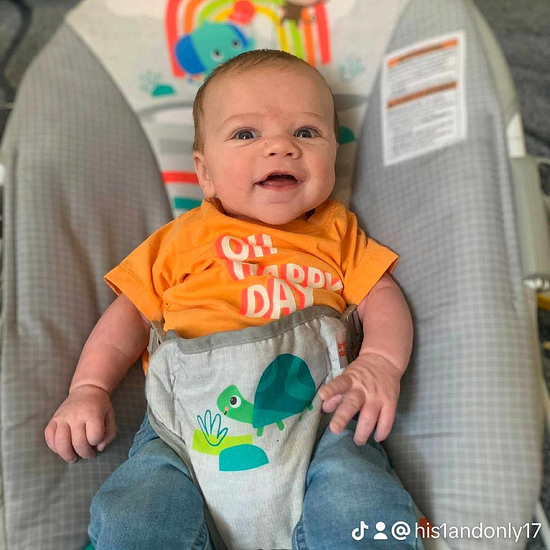 Isaiah is registered to the contest to win money with this photo: baby, clothing, couch, cushion, face, furniture, happy, head, homedecor, jeans, laughing, newborn, pants, person, photography, portrait, sitting, sleeping, smile, t_shirt