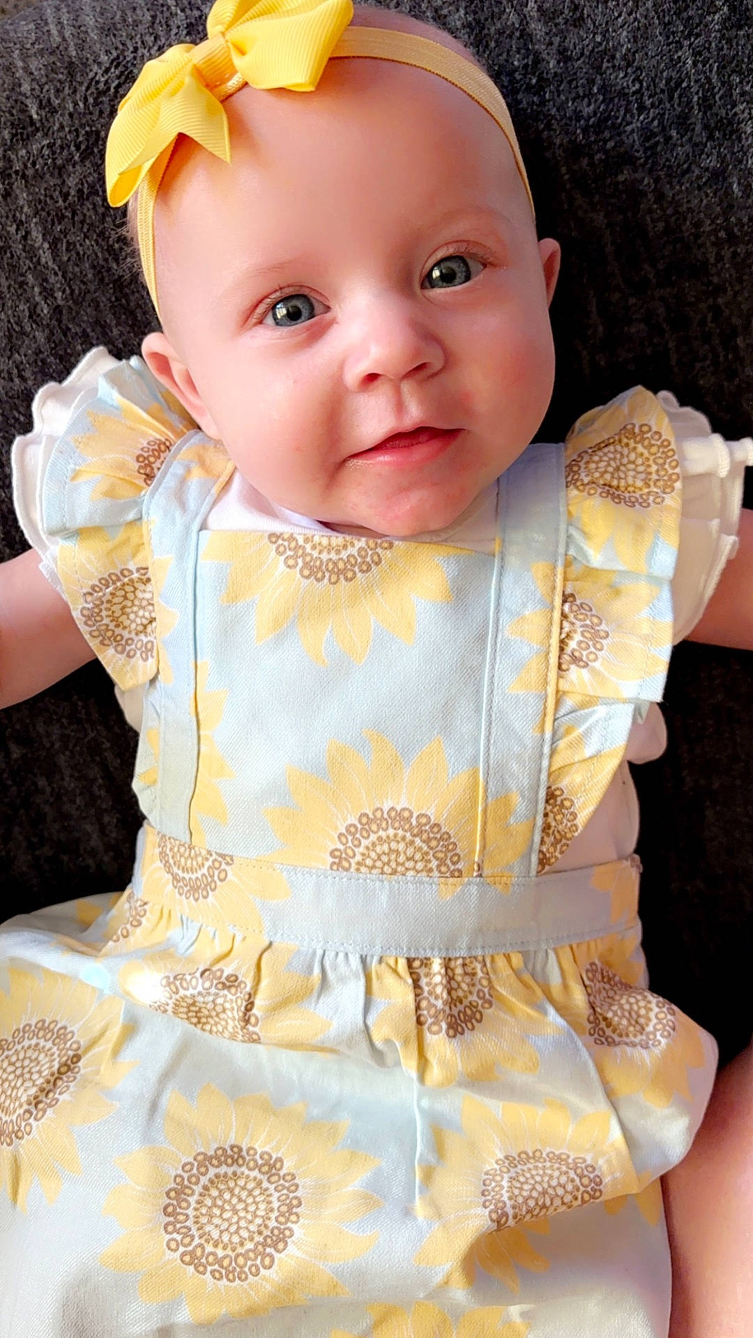 Alora is registered to the contest to win money with this photo: accessories, baby, blouse, bonnet, clothing, dress, face, fashion, formalwear, frown, hat, head, headband, homedecor, newborn, person, photography, portrait, sad, toy