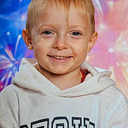 Vadim participe au concours pour gagner de l'argent avec cette photo : blonde_hair, blue_eyes, casual_clothing, child, colorful_background, cute, face, fireworks_effect, happy, head_and_shoulders, hoodie, indoor, kid, light_skin, person, photography, portrait, smiling, studio_background, young_child