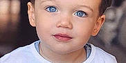 Alexio participe au concours pour gagner de l'argent avec cette photo : child, toddler, blue_eyes, portrait, face, white_shirt, short_hair, cute, indoors, looking_at_camera, innocence, skin, eyelashes, lips, cheeks, head, person, young_child, casual_clothing, soft_lighting
