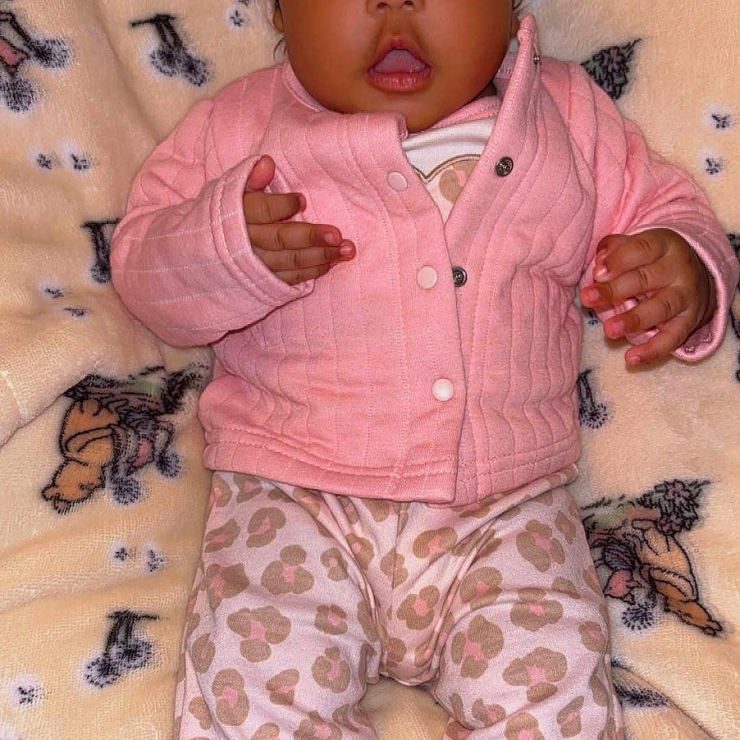 Blessynn is registered to the contest to win money with this photo: baby, blanket, child, cute, expression, face, hands, headband, indoor, infant, jacket, leopard_print, lying_down, pants, pattern, pink_clothing, portrait, soft_texture, warm, wide_eyes