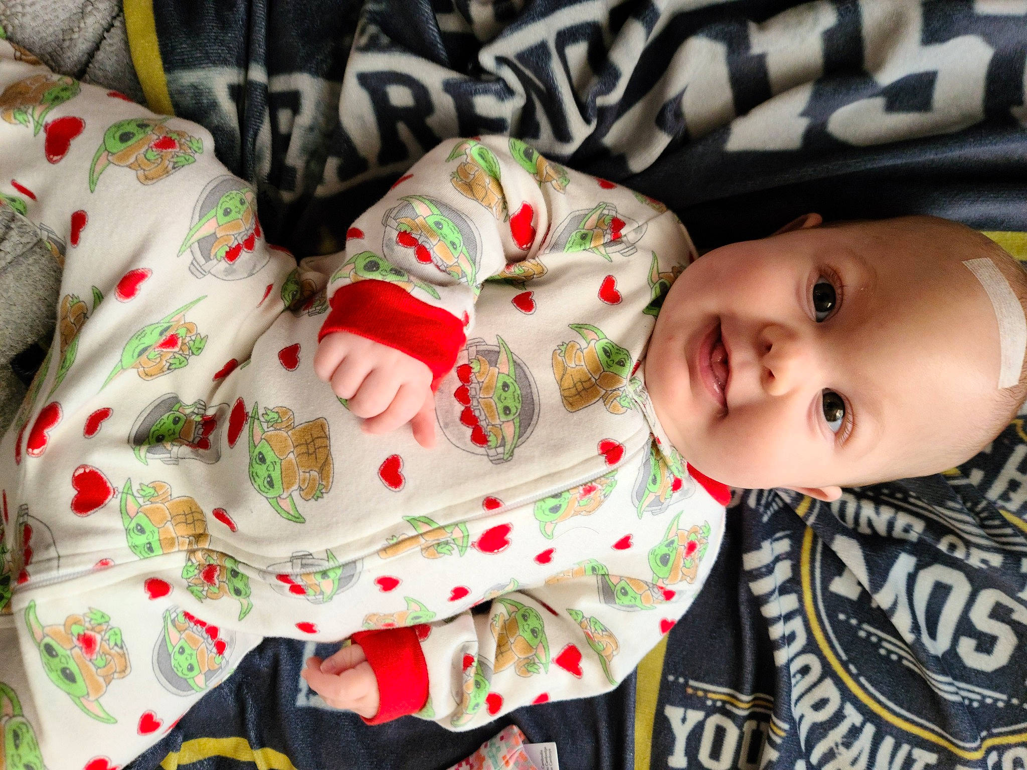 Dixie is registered to the contest to win money with this photo: baby, baby_toddler_clothing, carmine, cheek, child, collar, event, facial_expression, happy, holiday, linens, mammal, pattern, person, skin, sleeve, smile, textile, toddler, tradition