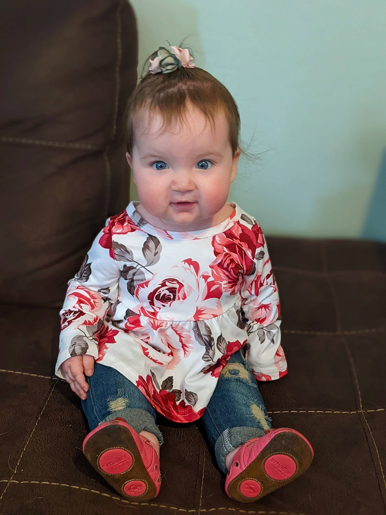 Zelda is registered to the contest to win money with this photo: baby, baby_toddler_clothing, carmine, cheek, child, comfort, eye, face, flooring, fun, happy, head, headpiece, iris, pattern, person, sitting, skin, sleeve, toddler