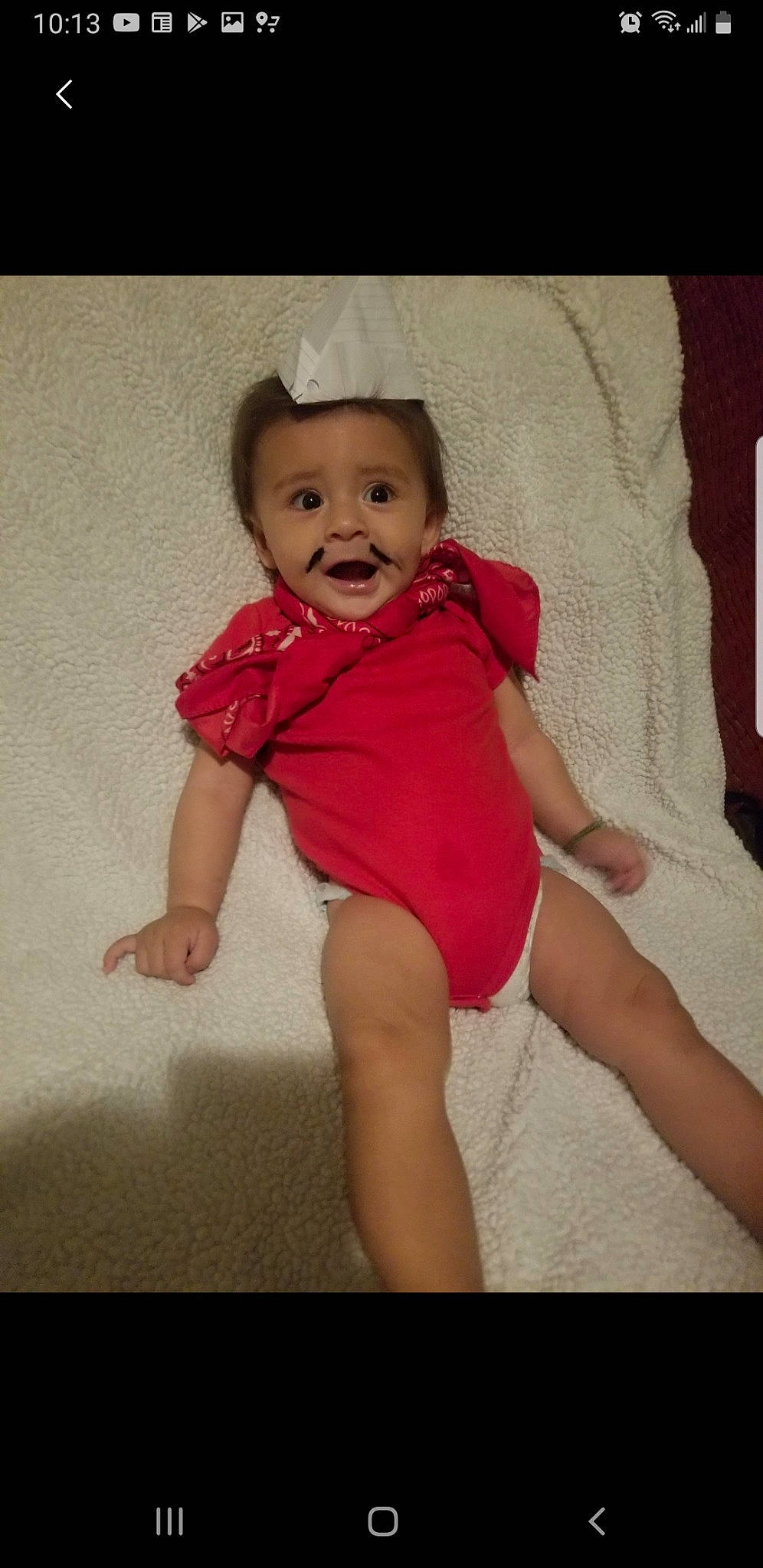 Lian is registered to the contest to win money with this photo: arm, baby, baby_toddler_clothing, cheek, child, diaper, facial_expression, human_leg, leg, lip, person, pink, skin, smile, surprise, thigh, toddler