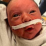 Dawson joined the competition — help win amazing prizes! newborn, baby, infant, face, eyes, hospital, medical_tube, nasal_tube, closeup, skin, person, clothing, white, bed, care, health, cute, expression, head, young