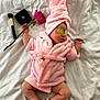baby, bed, compact, cucumber_slices, cute, headwear, infant, lying_down, makeup_brush, pampering, pink_robe, pink_towel, relaxation, rose, skin, sleeping, slippers, soft_texture, spa_theme, white_bed