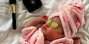 Michelle is registered to the contest to win money with this photo: baby, bed, chanel, compact, cosmetics, cucumber_slices, cute, indoor, infant, makeup_brush, peaceful, pink_robe, portrait, relaxation, skin_care, sleeping, soft_texture, spa, towel_turban, white_bed_sheet
