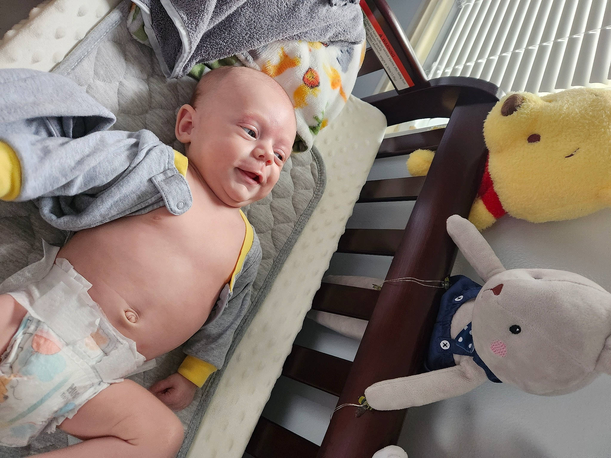 Colton is registered to the contest to win money with this photo: baby, baby_carriage, baby_products, baby_toddler_clothing, car_seat, comfort, fun, happy, organ, people, person, plush, product, room, sitting, smile, stuffed_toy, toddler, toy, white