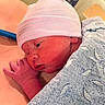 Delilah joined the competition — help win amazing prizes! newborn, baby, infant, sleeping, hospital, blanket, knit_cap, striped, portrait, face, hand, closed_eyes, swaddled, pink, soft_lighting, close_up, resting, medical_setting, newborn_photography, peaceful