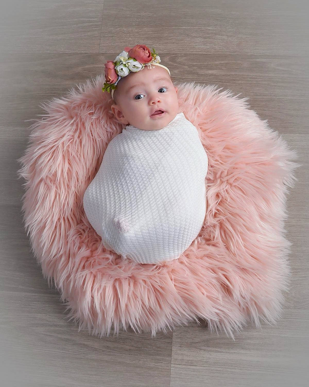 Megan joined the competition — help win amazing prizes! baby, baby_toddler_clothing, bridal_accessory, cap, costume, costume_hat, dress, embellishment, fashion_accessory, fur, fur_clothing, hair_accessory, headband, headpiece, headwear, human_body, peach, person, petal, pink