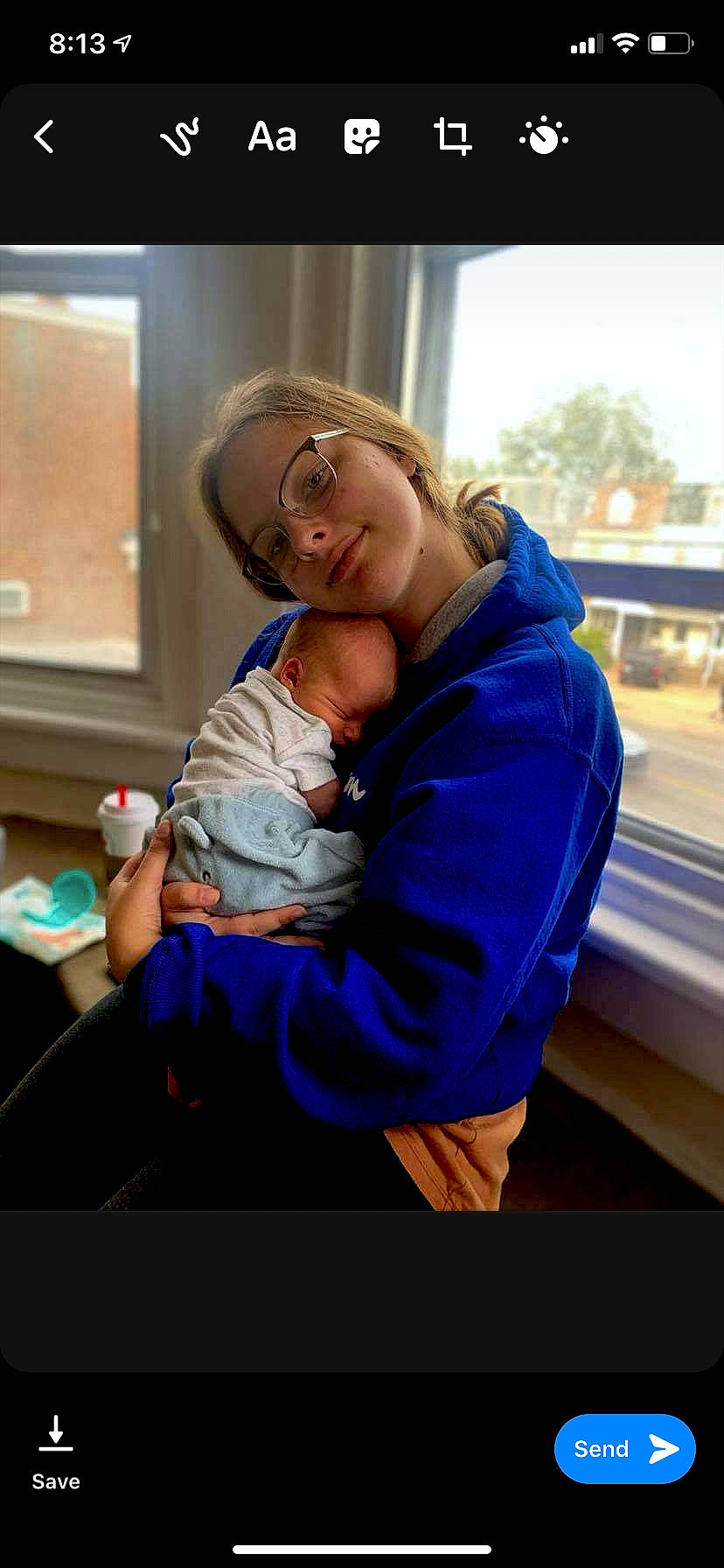 Asher is registered to the contest to win money with this photo: abdomen, baby, blond, child, comfort, electric_blue, eyewear, finger, fun, gesture, glasses, happy, hug, leisure, person, sitting, skin, sky, smile, standing