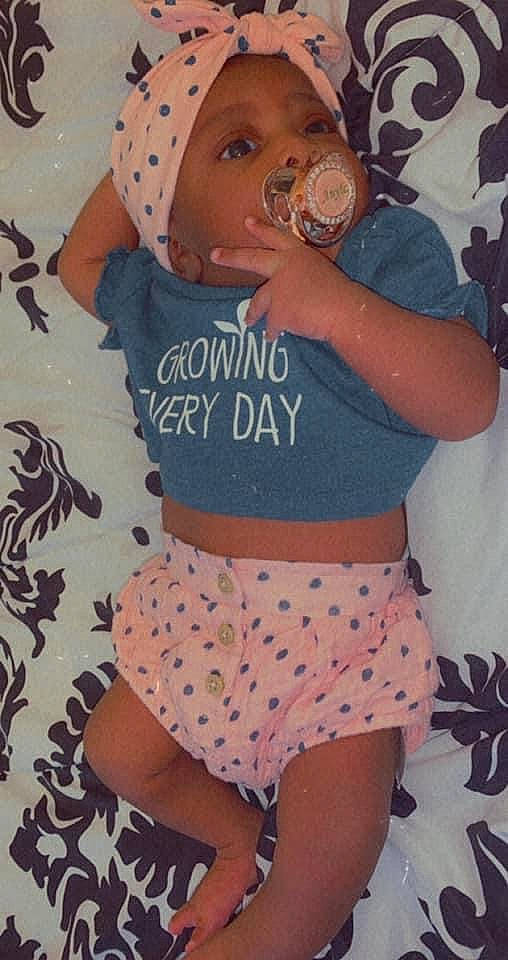 Anyla is registered to the contest to win money with this photo: abdomen, active_tank, baby_toddler_clothing, crop_top, drinking, headwear, hip, pattern, peach, person, polka_dot, shoulder, stomach, style, thigh, trunk, waist