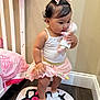 Kehlani Rose joined the competition — help win amazing prizes! toddler, child, indoor, toy, doll, pink_skirt, white_top, hair_bow, carpet, hello_kitty, bed, blanket, floor, wood_floor, wall, cute, standing, person, baby, footwear