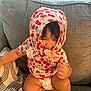 Kehlani Rose joined the competition — help win amazing prizes! toddler, child, smiling, couch, blanket, clothing, hood, patterned, indoor, baby, cute, playful, happy, person, face, sitting, diaper, furniture, home, cozy